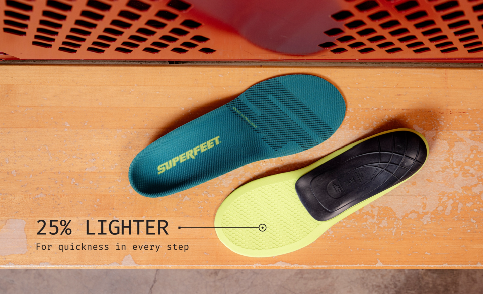 Superfeet's Sport Ultralight Insole on a wooden bench. Text reads "25% Lighter For quickness in every step"