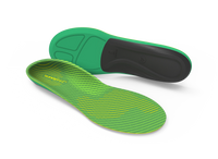 Green and black shoe insoles on a white background