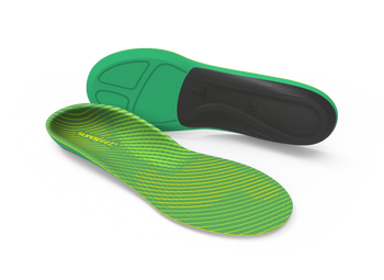 Green and black shoe insoles on a white background