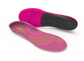 Pink and black shoe insoles on a white background
