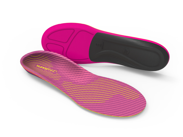 Pink and black shoe insoles on a white background